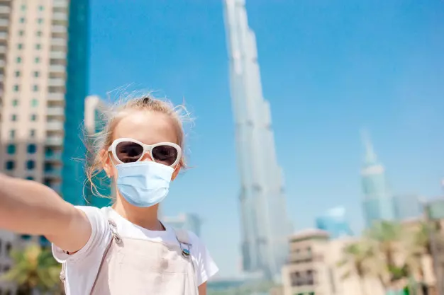 538427happy-girl-walking-dubai-with-skyscrapers_109800-13776.jpg